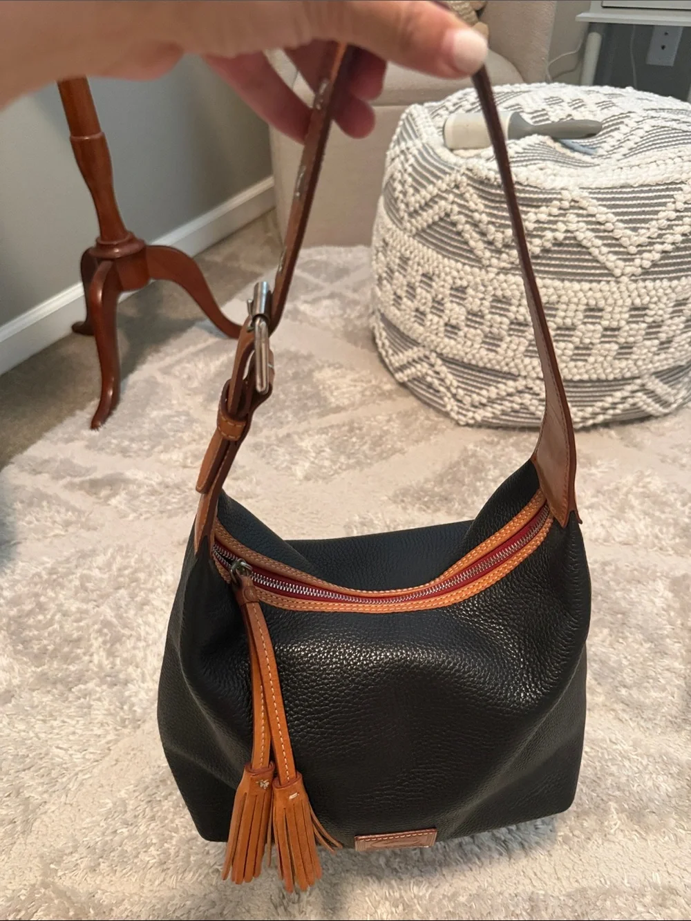 Dooney & Bourke Black and Tan Pebbled Leather Hobo with Tassel